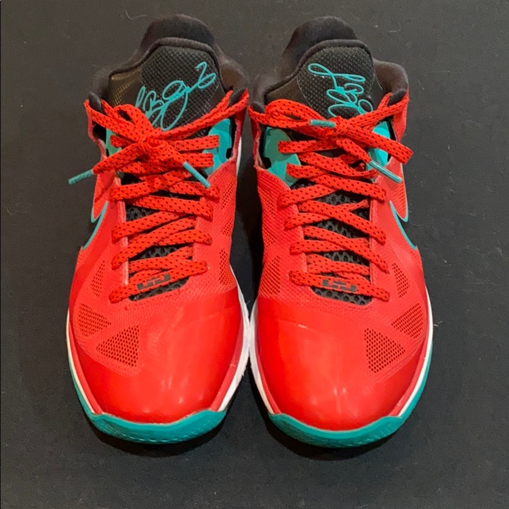 Red lebrons with printed signature on the tongue